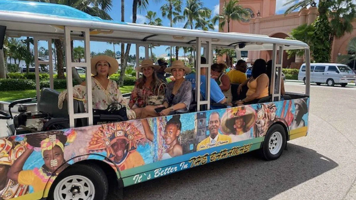 Electric trolley tour passing the Queen's Staircase in Nassau, a shore excursion on a Bahamas cruise from Miami