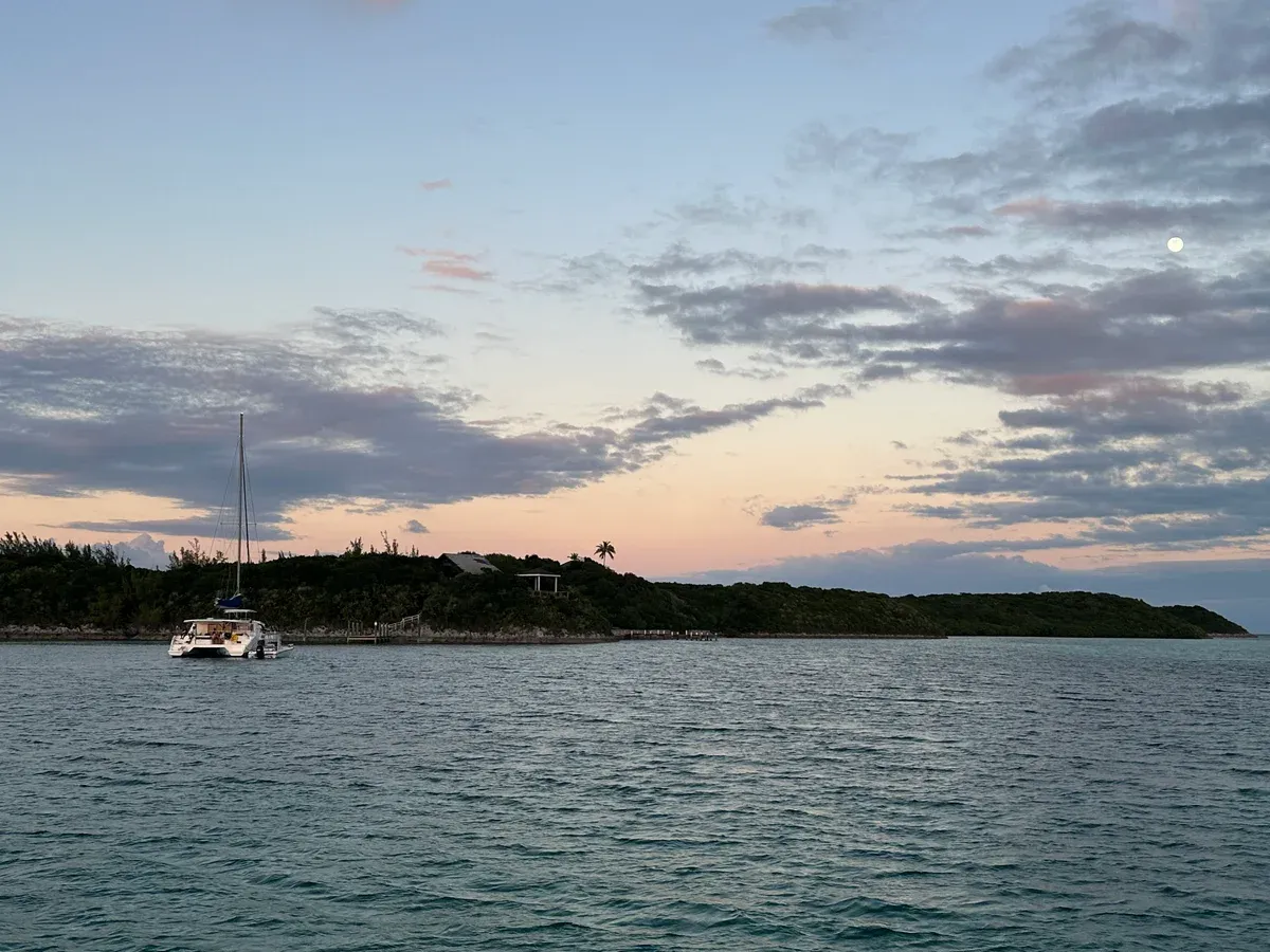 Catamaran anchored off Rose Island, the trip behind Rose Island swimming pigs tours